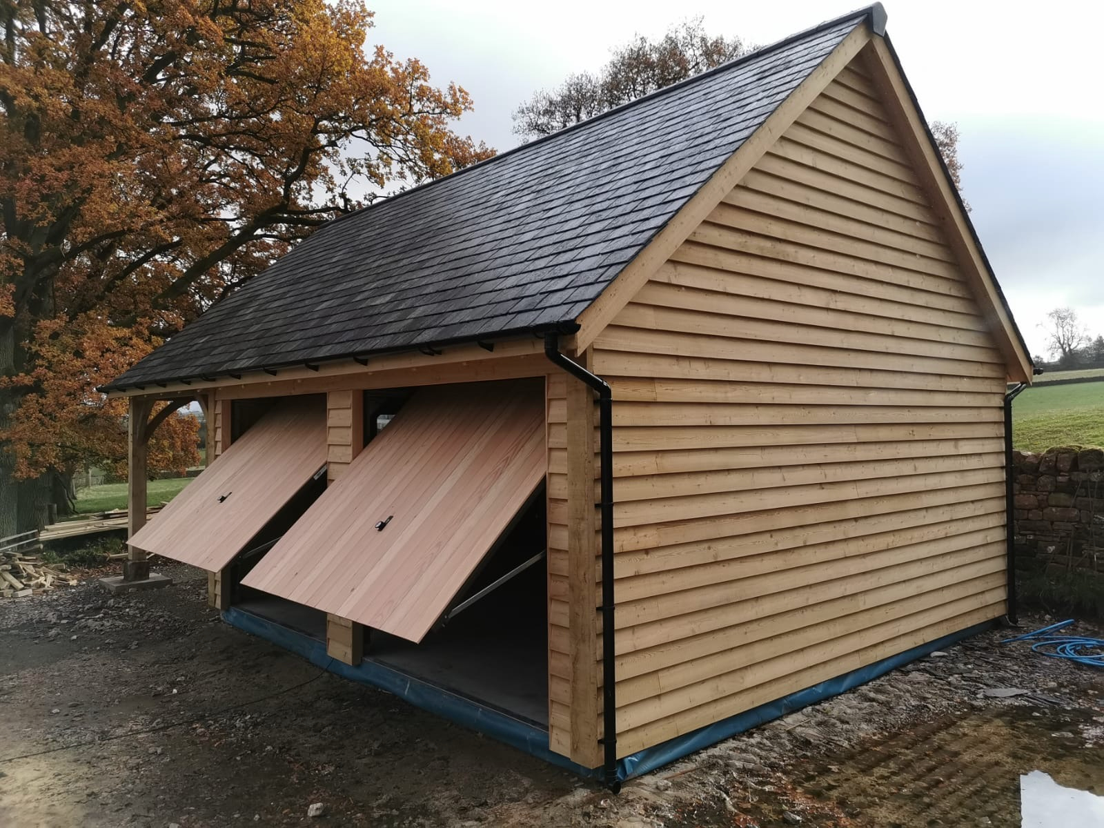 Oak-framed garage or carport by Woodstyle Joinery