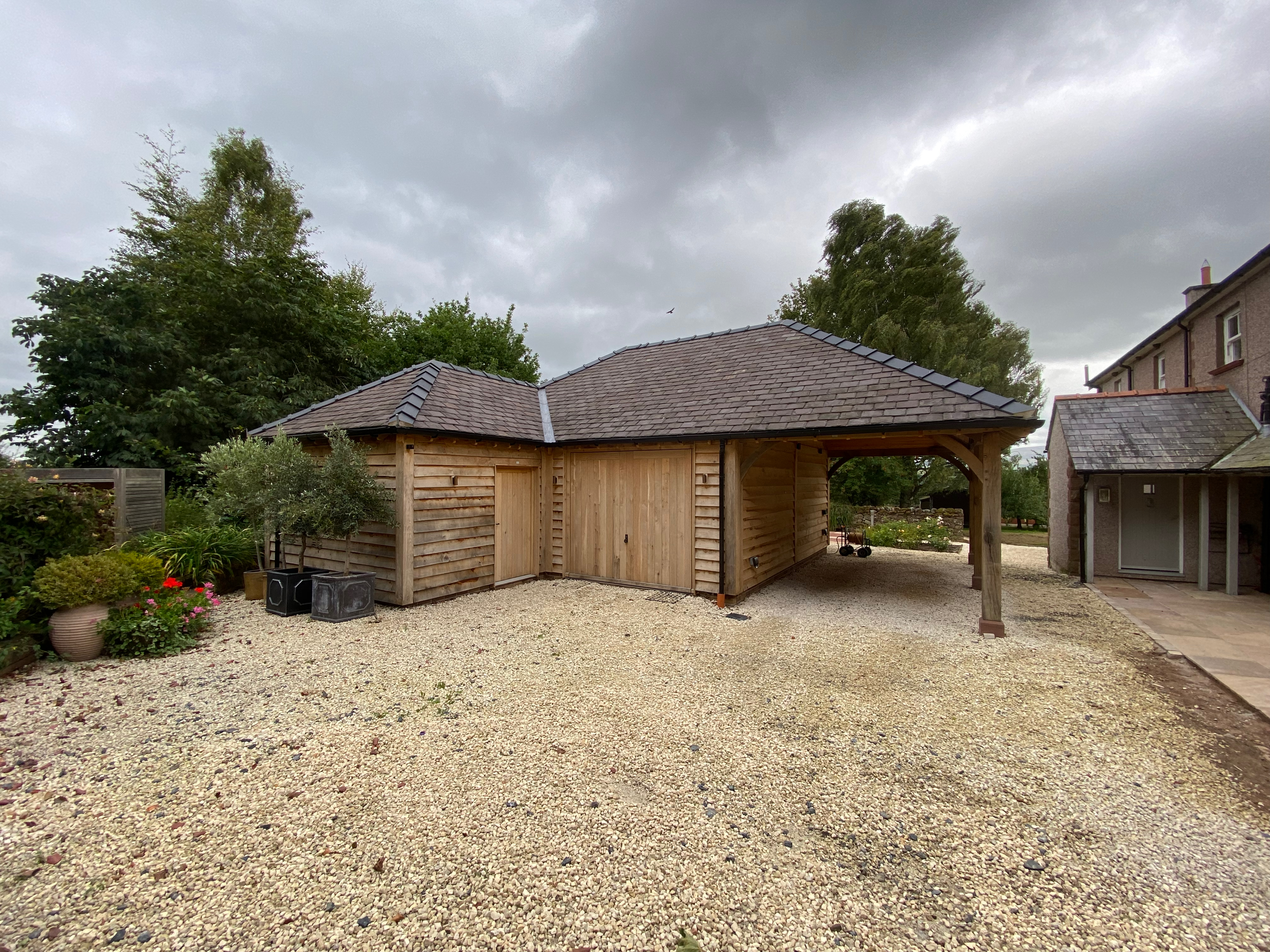 Oak-framed garage or carport by Woodstyle Joinery