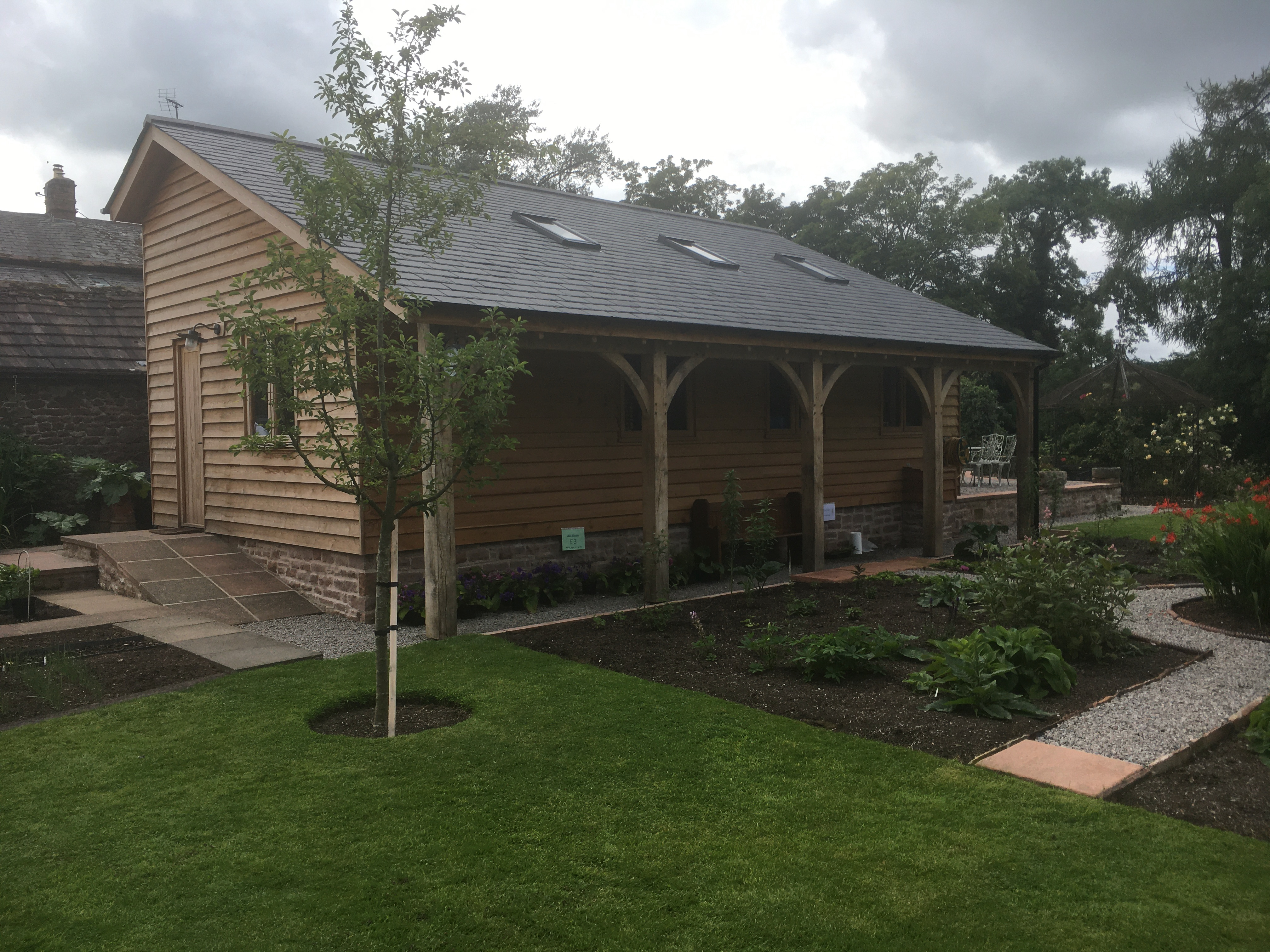 Oak-framed garage or carport by Woodstyle Joinery